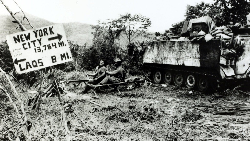 War and Conflict, The Vietnam War, near Khe Sanh, South Vietnam, pic: circa 1968, American soldiers close to the Laos border with a board reminding them of their long distance from home (Photo by Rolls Press/Popperfoto/Getty Images)